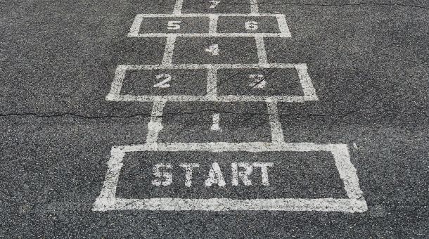 hop scotch painted on tarmac with a start box